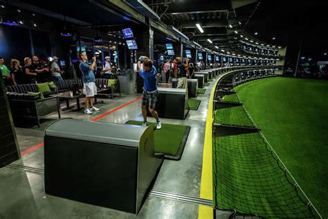 Topgolf webster - The Topgolf Experience. So what is Topgolf? In short, we’re a sports entertainment complex that features an inclusive, high-tech golf game that everyone can enjoy, paired with an outstanding food and beverage menu, climate-controlled hitting bays and music. Every Topgolf has an energetic hum that you can feel right when you walk through the door.